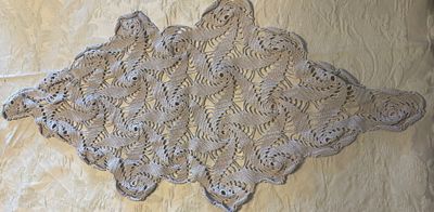 Lace Coth. Handmade lace cloth in an oval shape. Signs of use.