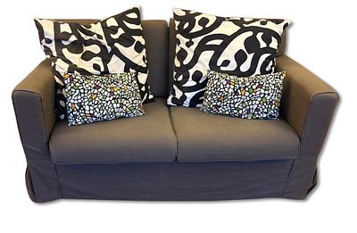 2 - Seater Sofa. Two-seater English-style sofa in fabric. Includes 4 decorative cushions with 