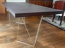 Dining Table. Contemporary style dining table with Zebrano veneer top and polished brass base. Image - 4