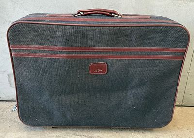 Vintage Travel Suitcase. Vintage wheeled suitcase with interior dividers. Signs of use.