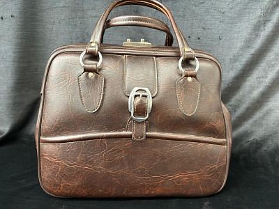 Vintage Bag. Vintage imitation leather bag with red fabric lining. Signs of wear.