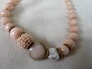 Necklace with pink stones, beads, and gold details. Signs of wear.Image - 1