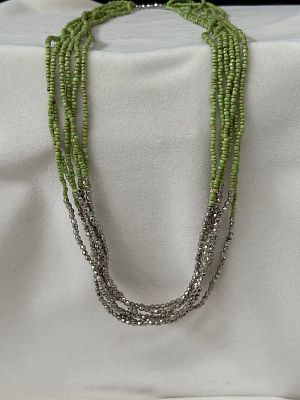 Necklace made of green and silver beads. Signs of wear.