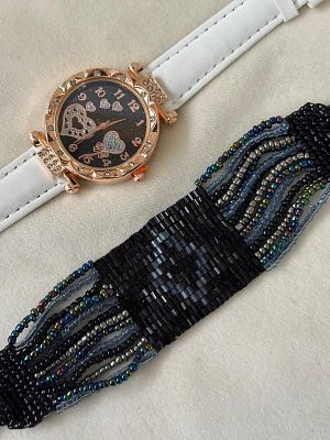 Set of Watch and Bracelet. Set consisting of one watch and a vintage beaded bracelet. Signs of wear.