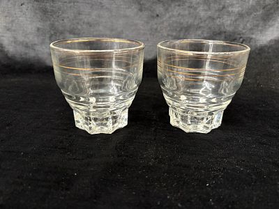 Set of 2 Glasses. Set of 2 glass cups with gold rims for water or juice. Signs of use.