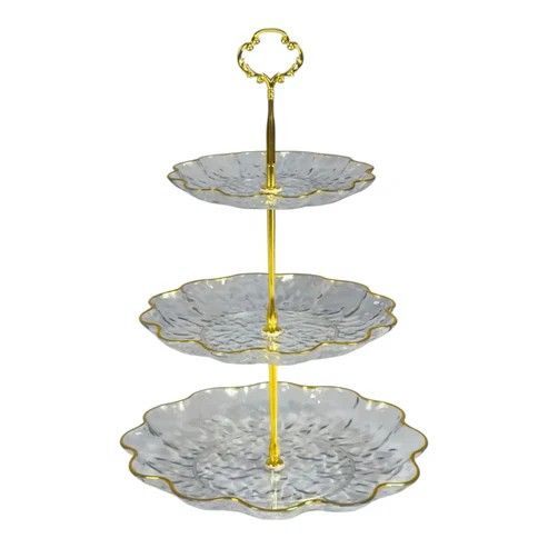 Cake Display . Three-tiered plastic cake or appetizer stand with a gold rim.