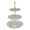 Cake Display . Three-tiered plastic cake or appetizer stand with a gold rim.Image - 1