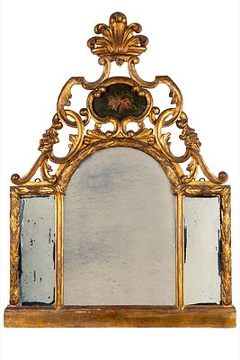 Specchiera tripartita in legno intagliato. Secolo XIX h. cm 94; l. cm 70 Fregi a volute di 