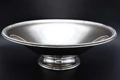 Smooth fruit bowl with a pearled rim in Portuguese silver. An interesting ice bucket with tongs 
