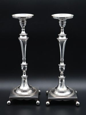 Pair of Portuguese Silver Candlesticks "1.&ordm; T&iacute;tulo". Plain decoration with beaded friezes. 