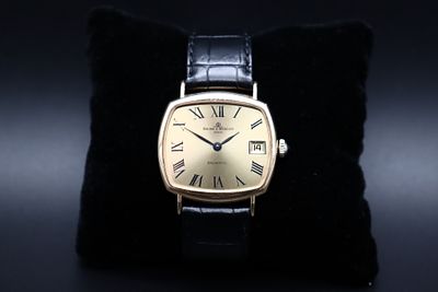 Baume et Mercier - ‘Baumatic’ wristwatch (c. 1980). 750‰ gold case. 
Automatic. 
Comes with case 