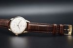 OMEGA - ‘Classic’ model wristwatch, c. 1950. Manual winding. 
Gold-plated case. 
With papers. Image - 2