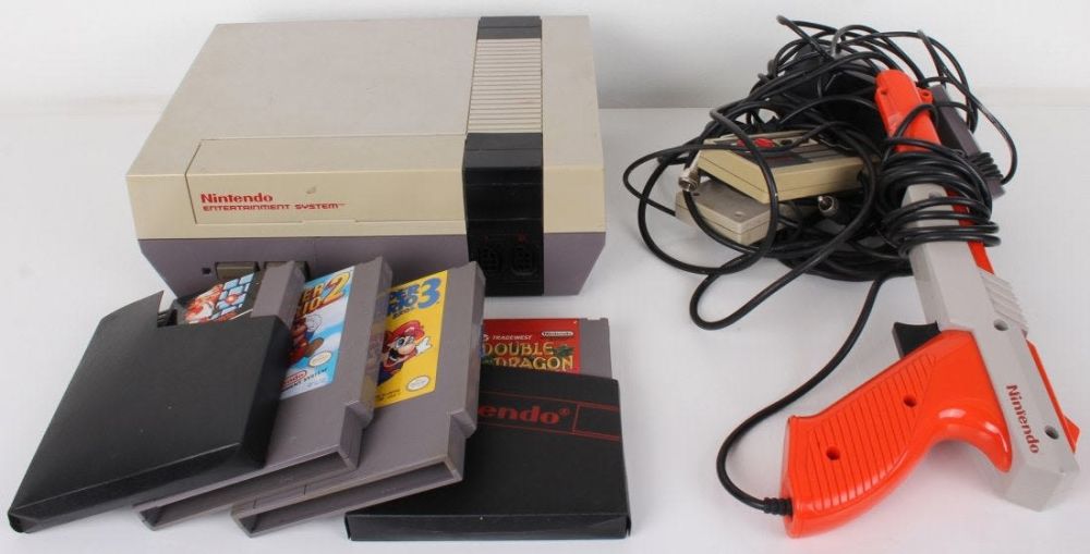 Lot 11669: NES CONSOLE, 2 JOYPADS, ZAPPER & 4 GAMES -LOT OF 8