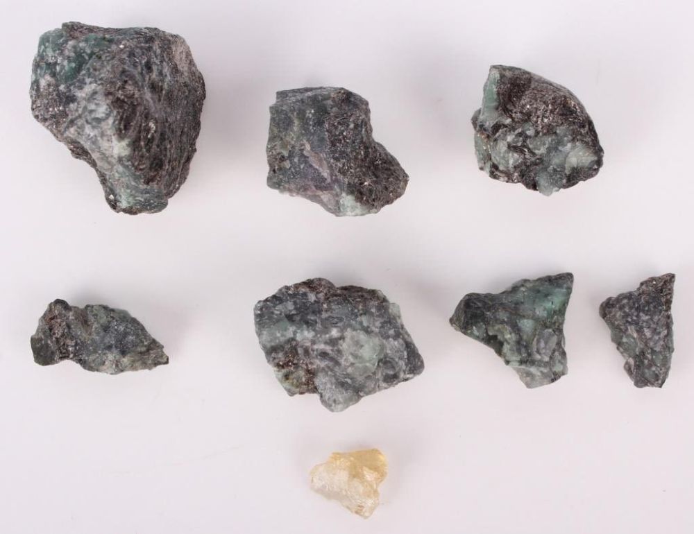 Lot 119248: ROUGH EMERALDS AND TOURMALINE - LOT OF 8