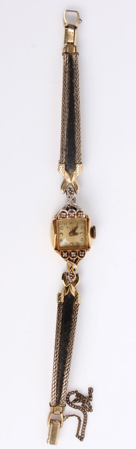 Lot 121302: 14K YELLOW GOLD DIAM. BULOVA WATCH W/ 10K GF BAND