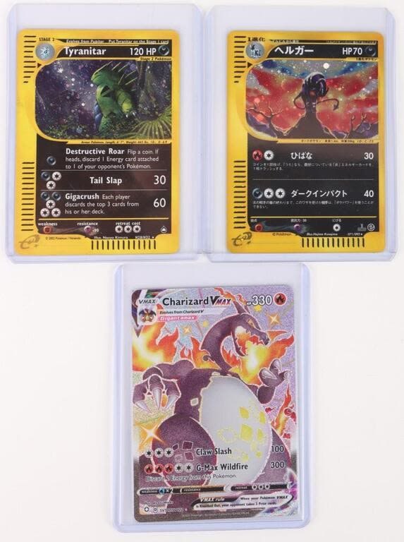 Lot 144252: CHARIZARD, TYRANITAR, & HOUNDOOM POKEMON CARDS