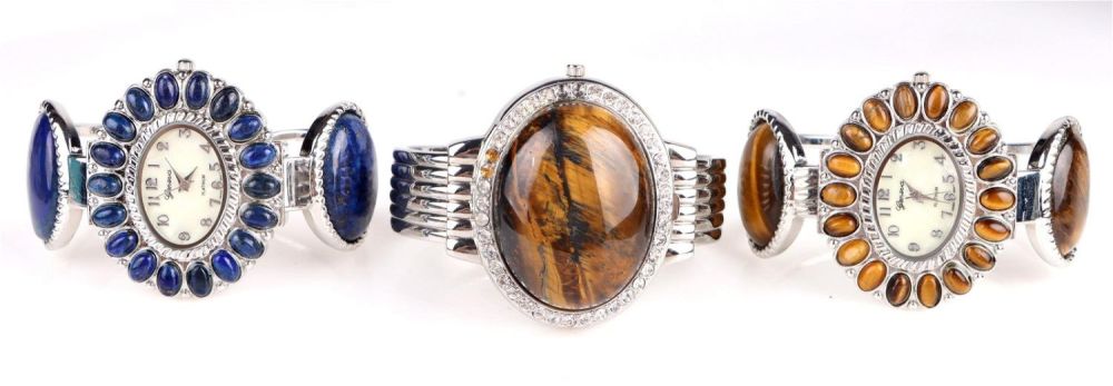 Lot 156181: GENEVA TIGER'S EYE & LAPIS LADIES CUFF WATCHES