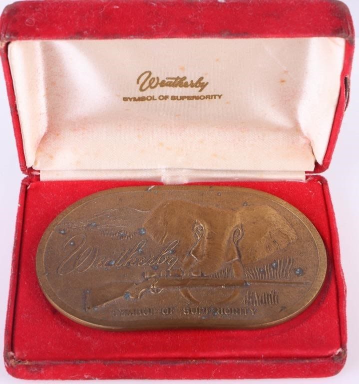 Lot 173322: VINTAGE WEATHERBY BRASS BELT BUCKLE WITH CASE