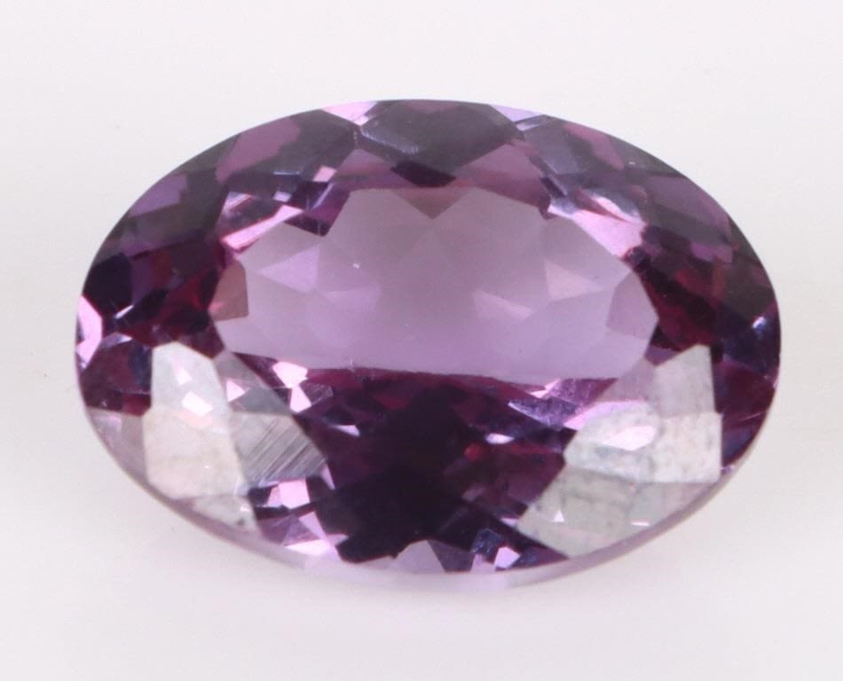 Lot 174159: 10.25CT OVAL NATURAL BI-COLOR SAPPHIRE W/ GIE CERT