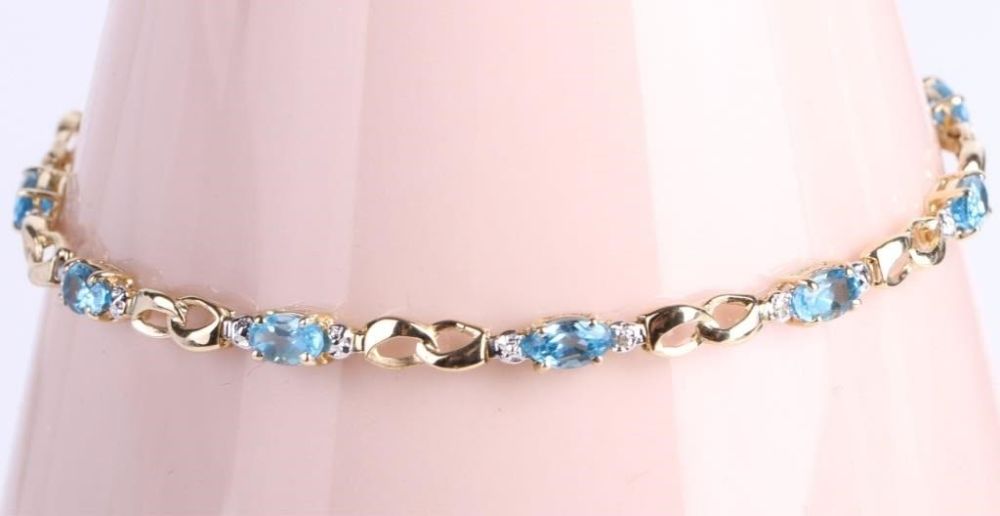 Lot 179157: 14K YELLOW GOLD DIAMOND BLUE TOPAZ BRACELET