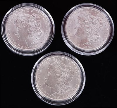 ASSORTED 90% SILVER MINT STATE MORGAN DOLLARS -(3). Assorted 0.90 silver Mint State Morgan 