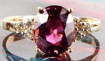 14K YELLOW GOLD LADIES RING W/ SIX 0.02K DIAMONDS. 14k yellow gold ladies ring with a pink