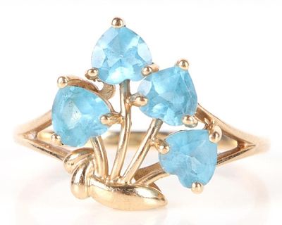 10K YELLOW GOLD BLUE TOPAZ HEART RING. 10K yellow gold blue topaz heart ring. Ring has four