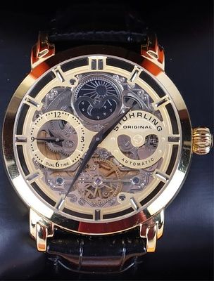 STUHELING ORIGINAL GOLD-TONE SKELETON WATCH. Stuheling original gold-tone skeleton automatic