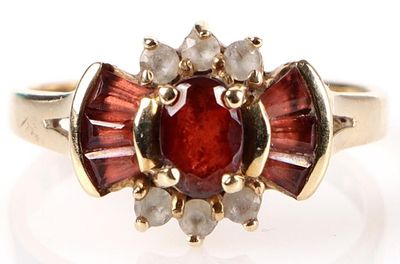10K YELLOW GOLD GARNET & CZ LADIES RING. 10k yellow gold garnet and cubic zirconium ladies 