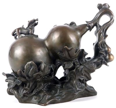 BRASS FENG SHUI WU LOU (GOOD LUCK GOURD) STATUE. Asian brass statue depicting a tilted Wu Lou, a 