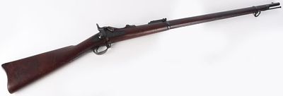 SPRINGFIELD 1884 TRAPDOOR US RIFLE. Springfield 1884 Trapdoor US rifle. Carving on the side 
