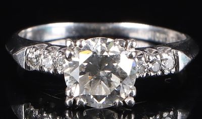 1.16CTW 90% PLATINUM LADIES RING W/ SEVEN DIAMONDS. 90% platinum ladies ring with a 1.10ct 