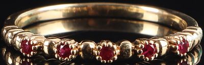 18K YELLOW GOLD RING W/ 4 RUBY GEMSTONES. 18k yellow gold ring with four small ruby gemstones 