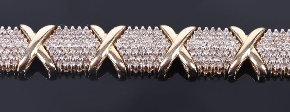 Lot 216242: 10K YELLOW GOLD "X" DESIGN DIAMOND BRACELET