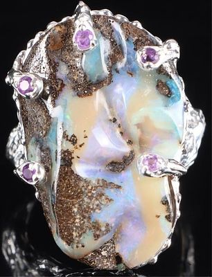 32CT BOULDER OPAL STERLING SILVER RING W/ AMETHYST. Brutalist-style sterling silver ring with a 