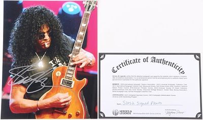 SIGNED SLASH PHOTOGRAPH GUNS N ROSES W/ COA. Signed photograph of the musician Slash playing the 