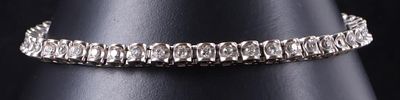 1.38 CTW DIAMONDS 14K WHITE GOLD LADIES BRACELET. 14k white gold ladies bracelet. The brackets 