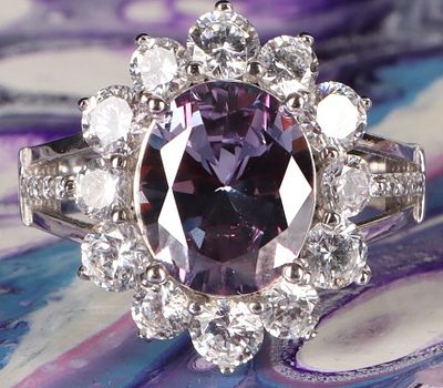 STERLING SILVER LADIES RING W/ BICOLOR SAPPHIRE. Sterling silver ladies ring with a 2.5ct oval 