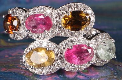 STERLING SILVER LADIES RING W/ TOURMALINE GEMS. Sterling silver ladies ring with six tourmaline 