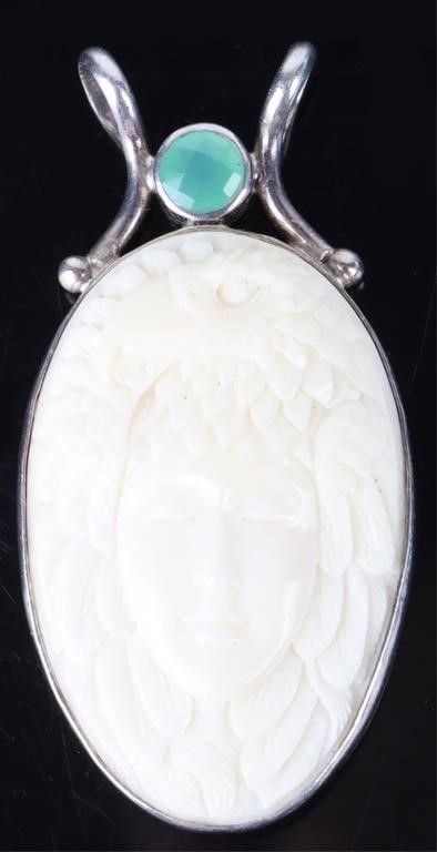 Lot 222274: SAJEN STERLING SILVER CARVED BONE PENDANT