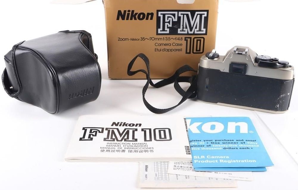 Lot 222446: NM+ NIKON FM10 35-70MM F/3.5-F/4.8 LENS, BOX, CASE