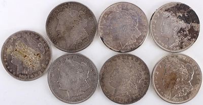 ASSORTED 90% SILVER MORGAN DOLLARS - (7). Seven assorted 90% silver Morgan Dollars.Weight: 