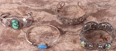 SOUTHWEST STERLING SILVER UNISEX BRACELETS (4). Signed Southwest sterling silver bracelets, some 