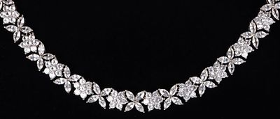 STERLING SILVER WHITE TOPAZ FLOWER NECKLACE. Sterling silver 12.71CTW white topaz flower motif 