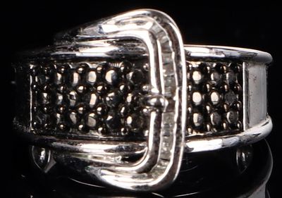 STERLING SILVER LADIES BUCKLE RING W/ DIAMONDS. Sterling silver ladies ring. The piece is 