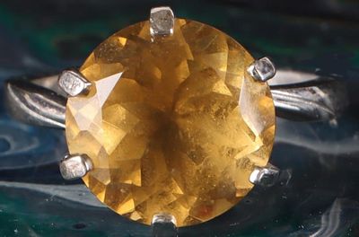 6CT YELLOW SPINEL STERLING SILVER LADIES RING. 6CT round diamond-cut spinel ladies ring set in 