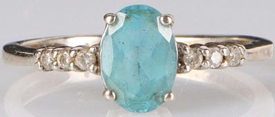 LADIES TOPAZ & DIAMOND STERLING SILVER RING. Ladies sterling silver ring with a 0.5CT oval-cut 