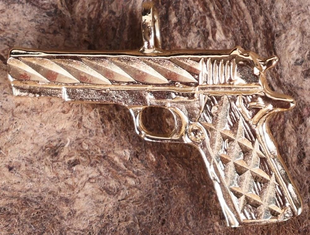 Lot 229312: 14K YELLOW GOLD MENS GUN PENDANT ETCHED DECOR
