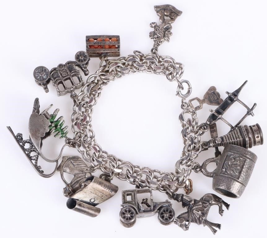 Lot 232247: STERLING SILVER ANTIQUE LADIES CHARMS