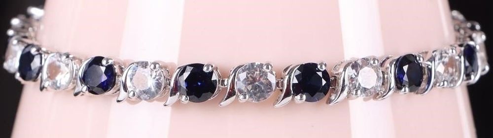 Lot 233010: 13.5CT SAPPHIRE & WHITE TOPAZ TENNIS BRACELET